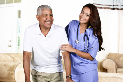 Doctor or nurse caregiver with senior man